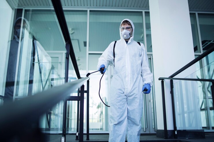 person-white-chemical-protection-suit-doing-disinfection-public-areas-stop-spreading-highly-contagious-corona-virus_342744-913